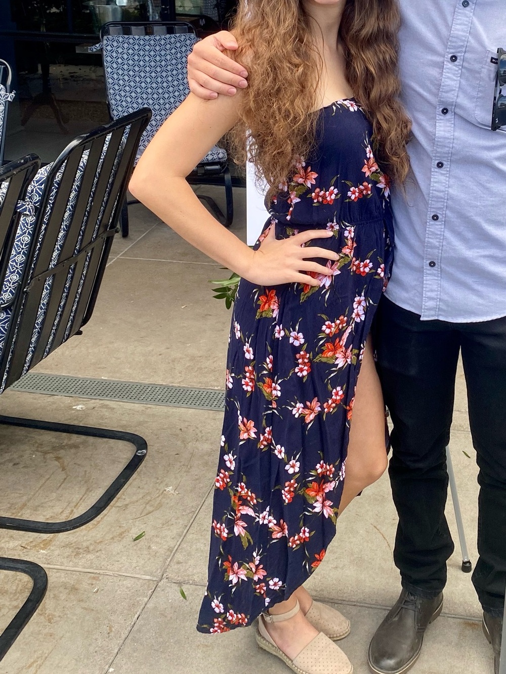 Navy blue floral Ambiance romper with high low skirt with an open front